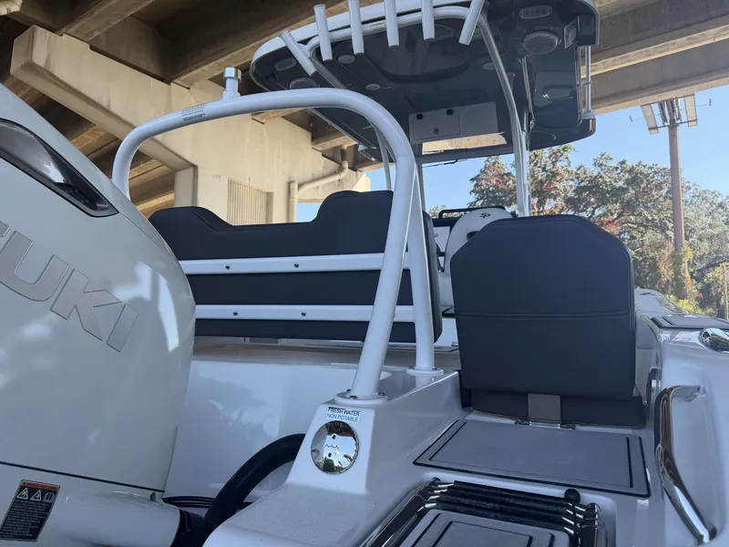 Slide: The Image of 2026 Sea Pro 245FLX R boat under bridge, Suzuki engine. - 6