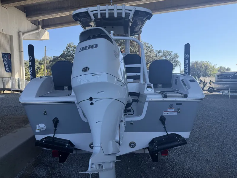 Slide: The Image of Rear view of a 2026 Sea Pro 245FLX R boat under a bridge. - 9