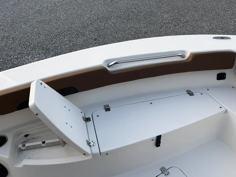 Slide: The Image of 2026 Sea Pro 202 Center Console with storage compartment and handrail. - 10