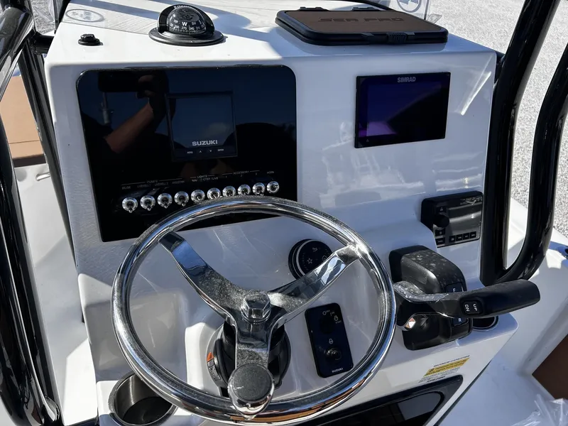 Slide: The Image of Steering console of the 2026 Sea Pro 230 Bay boat. - 13