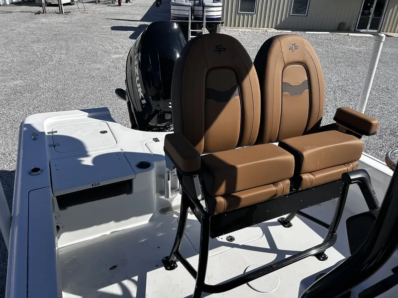 Slide: The Image of 2026 Sea Pro 230 Bay with brown seats and Suzuki engine. - 18