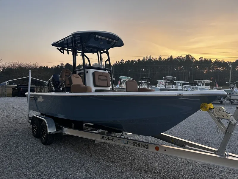 Slide: The Image of 2026 Sea Pro 230 Bay boat at sunset on trailer. - 8