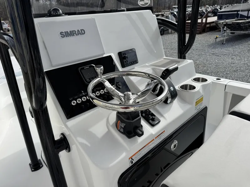 Slide: The Image of Steering console of the 2026 Sea Pro 250 Bay boat. - 9
