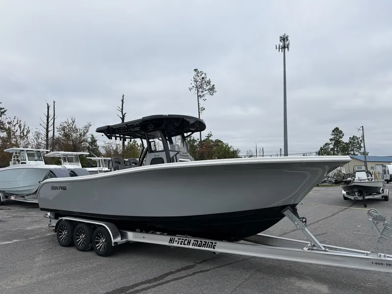 The Image of 2026 Sea Pro 292 SEAKEEPER on trailer, gray boat outdoors. - 1