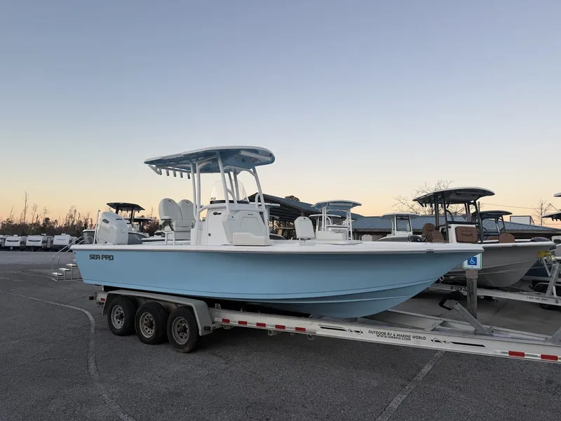The Image of 2026 Sea Pro 250 Bay boat on trailer at sunset. - 1