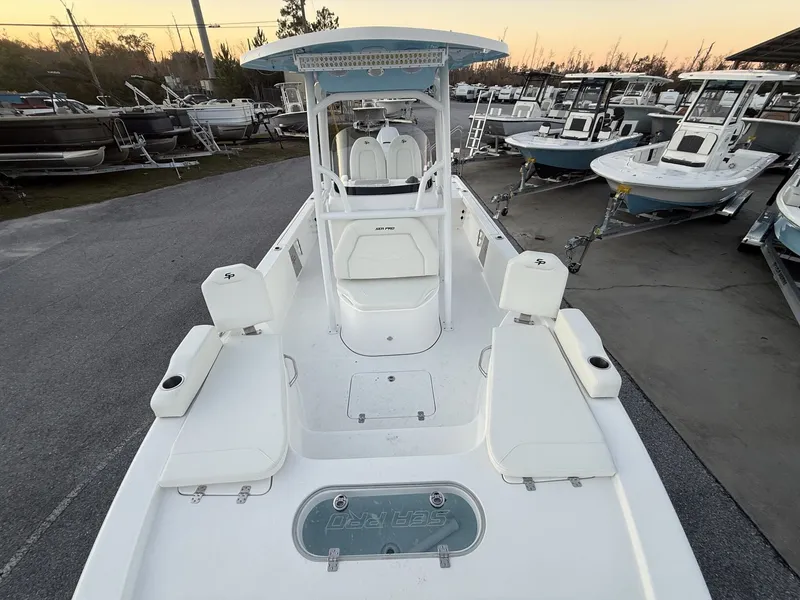 Slide: The Image of 2026 Sea Pro 250 Bay boat on a lot at sunset. - 5