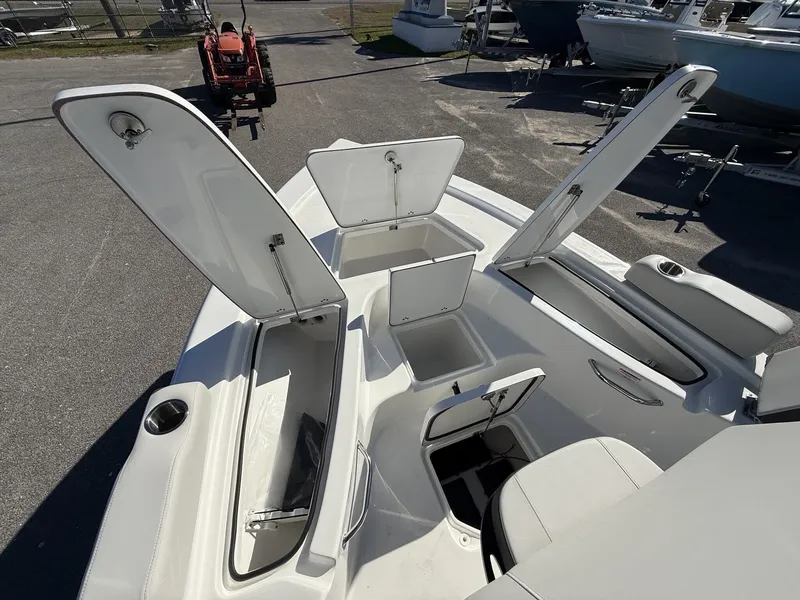 Slide: The Image of Interior view of 2026 Sea Pro 230 Bay with open storage compartments. - 6