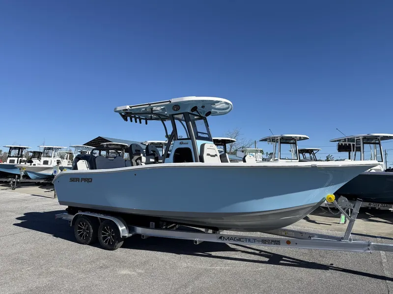 The Image of 2026 Sea Pro 245FLX R boat on trailer outdoors. - 1