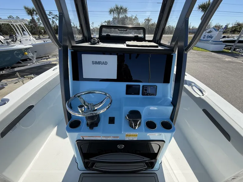 Slide: The Image of Interior view of 2026 Sea Pro 245FLX R with Simrad controls. - 12