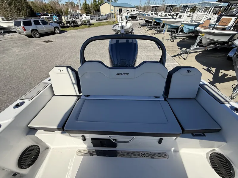Slide: The Image of Rear view of Sea Pro 245FLX R boat, 2026 model, in a parking lot. - 14