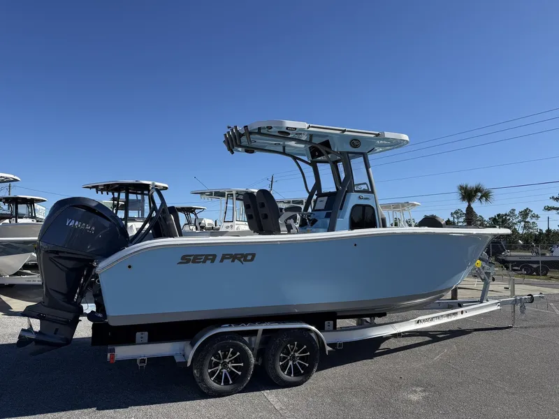 Slide: The Image of 2026 Sea Pro 245FLX R boat on trailer, blue sky. - 6