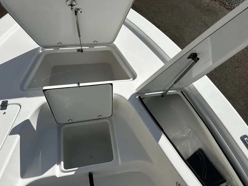 Slide: The Image of Open storage compartments on a 2026 Sea Pro 230 Bay boat. - 6