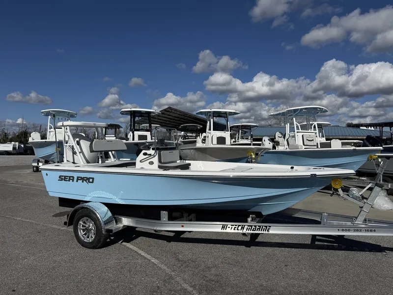 The Image of 2026 Sea Pro 172 Bay boat on trailer under blue sky. - 1