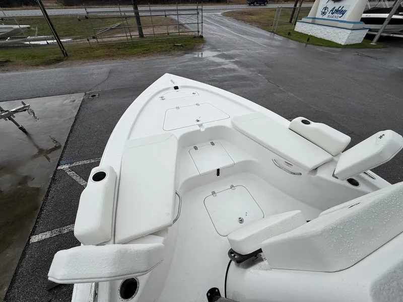Slide: The Image of 2026 Sea Pro 230 Bay boat with white seating and storage compartments. - 6