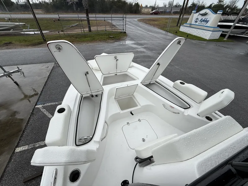 Slide: The Image of 2026 Sea Pro 230 Bay boat with open storage compartments. - 7