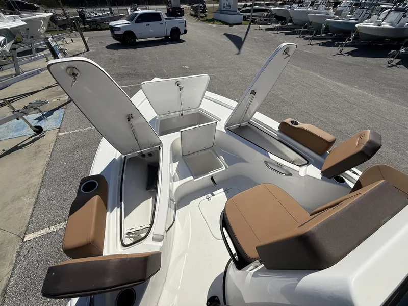 Slide: The Image of 2026 Sea Pro 230 Bay boat with open storage compartments and seating. - 10