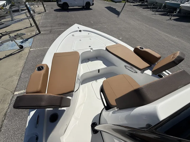 Slide: The Image of 2026 Sea Pro 230 Bay boat with brown seating in harbor. - 5