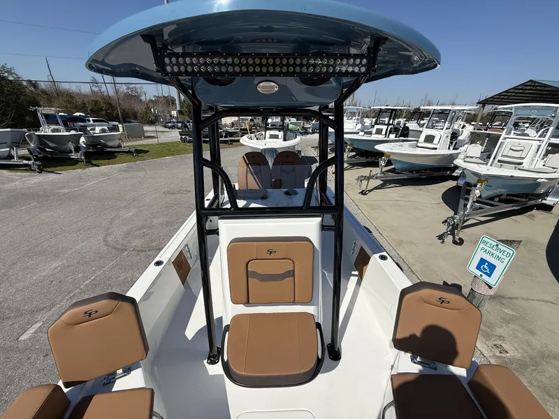 Slide: The Image of 2026 Sea Pro 230 Bay boat with brown seats and blue canopy. - 8