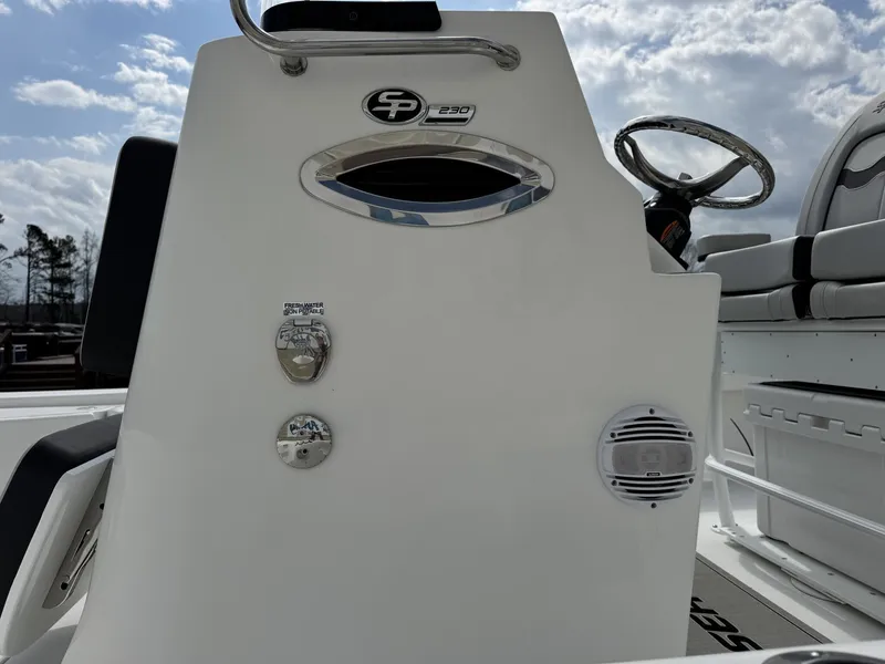 Slide: The Image of 2026 Sea Pro 230 Bay boat console with steering wheel and speaker. - 4