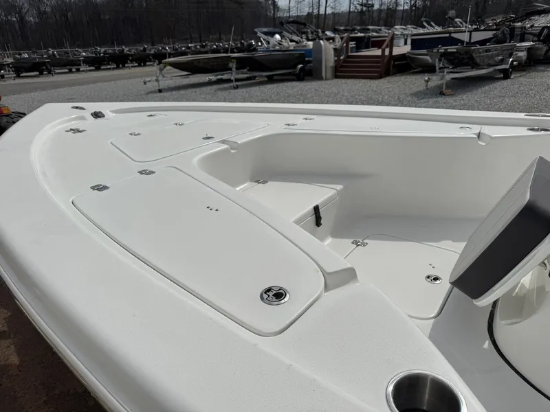 Slide: The Image of 2026 Sea Pro 230 Bay boat, front deck view outdoors. - 5