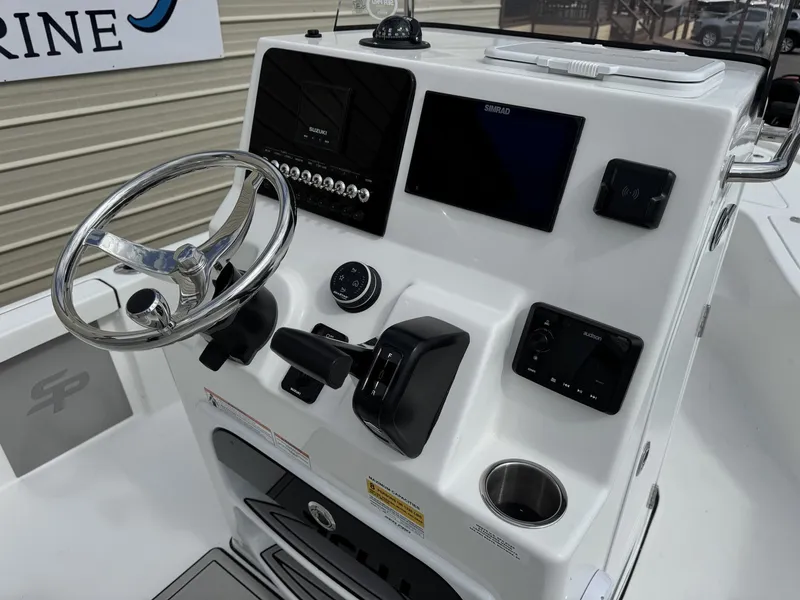 Slide: The Image of 2026 Sea Pro 230 Bay helm with modern controls and displays. - 9