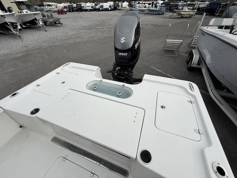 Slide: The Image of Sea Pro 250 Bay 2026 with Suzuki 350HP engine in parking lot. - 12