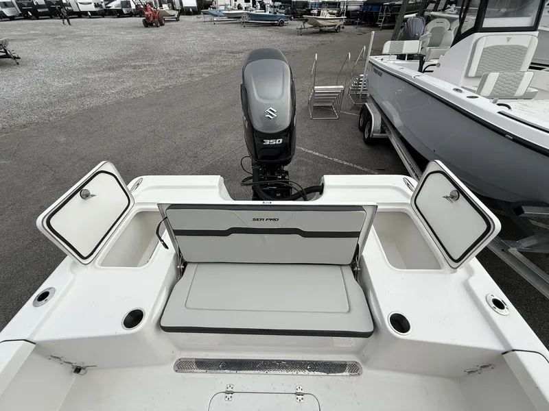 Slide: The Image of 2026 Sea Pro 250 Bay boat with 350HP engine in parking lot. - 14