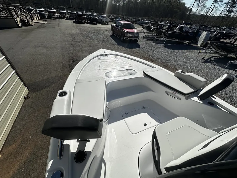 Slide: The Image of 2026 Sea Pro 250 Bay boat in parking lot with other vehicles. - 10
