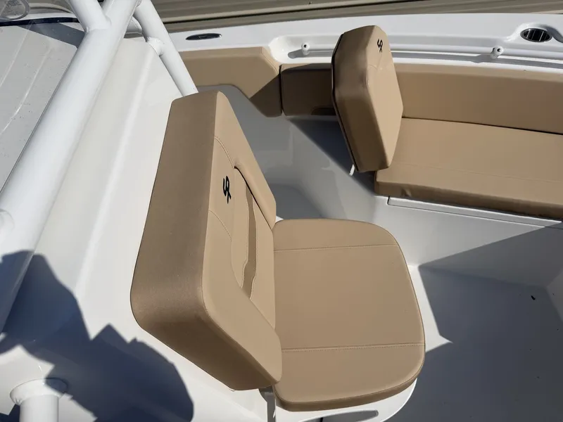 Slide: The Image of Interior of Sea Pro 225FLX Sandbar 2026 with beige seating. - 13