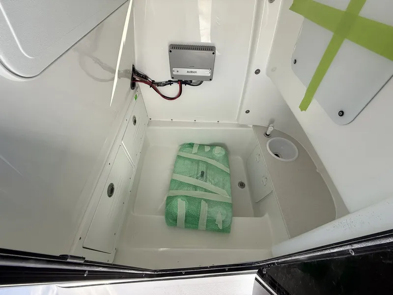 Slide: The Image of Interior of 2026 Sea Pro 245FLX with electronics and storage space. - 7