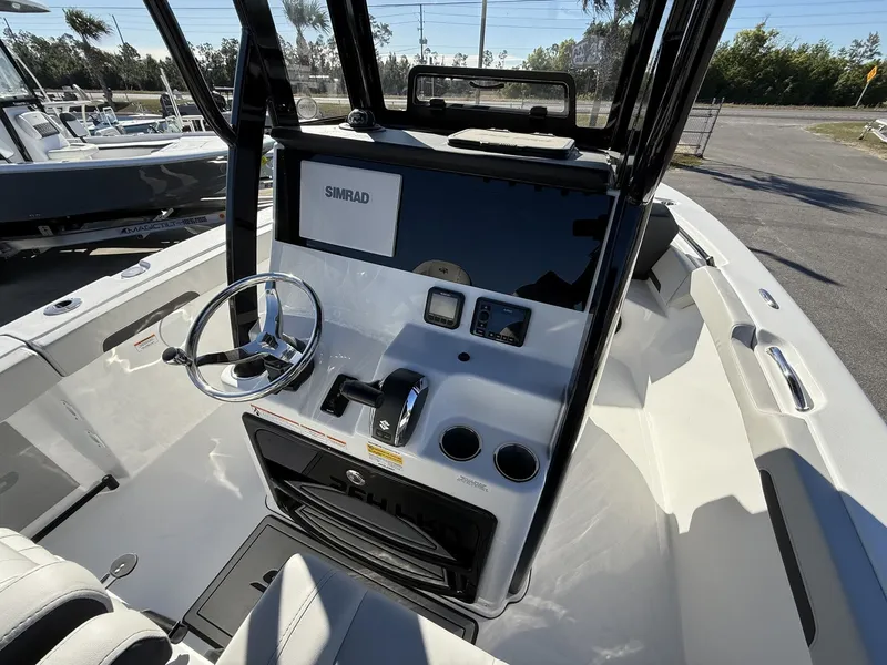 Slide: The Image of Interior view of Sea Pro 245FLX 2026 helm with Simrad display. - 8
