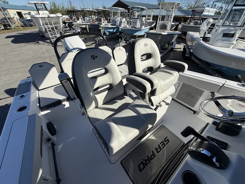 Slide: The Image of Interior of 2026 Sea Pro 245FLX featuring luxurious seating. - 9