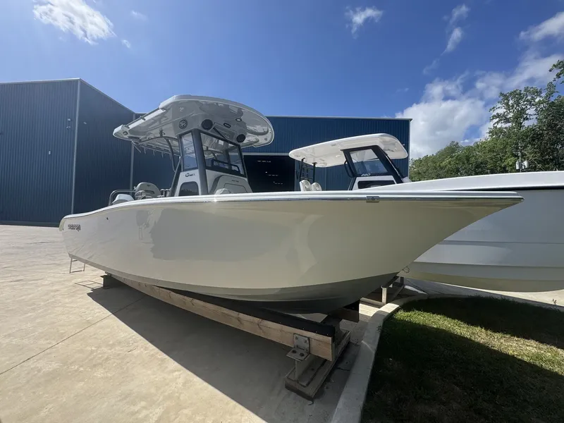 The Image of 2026 Sea Pro 245FLX R boat on a dock under sunny skies. - 1