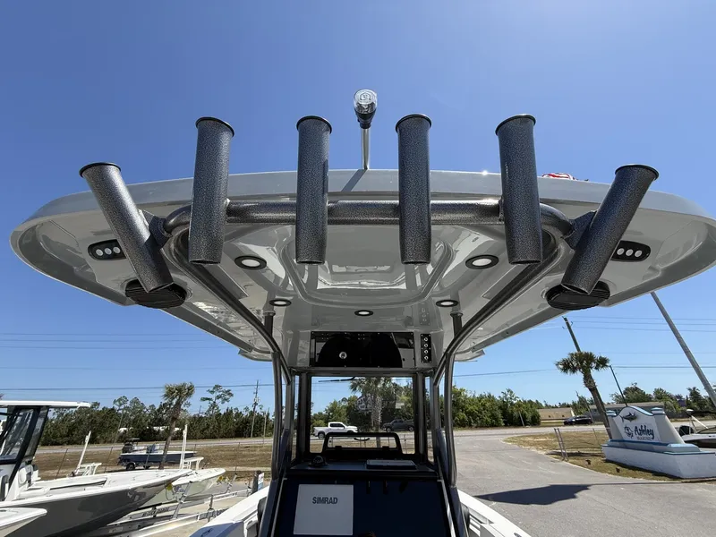 Slide: The Image of 2026 Sea Pro 242 DLX boat with rod holders and T-top. - 11