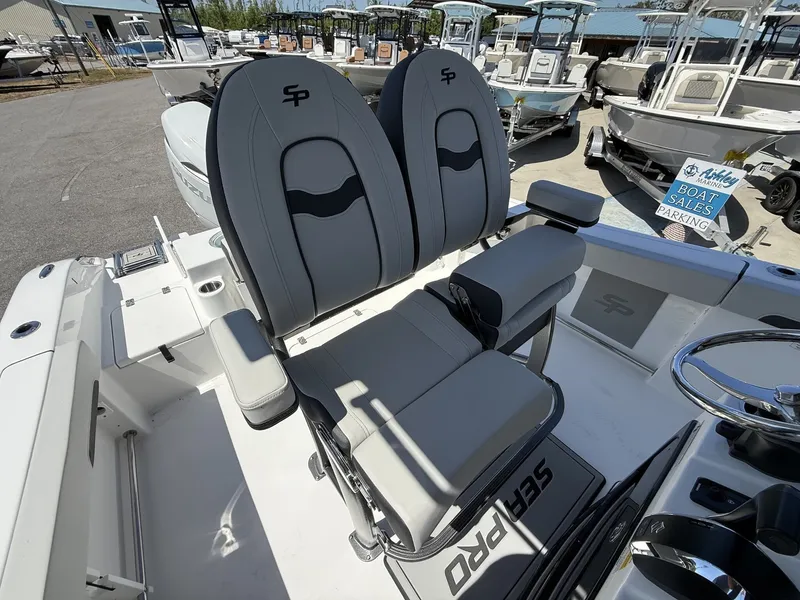 Slide: The Image of 2026 Sea Pro 242 DLX boat seats in sales area. - 12