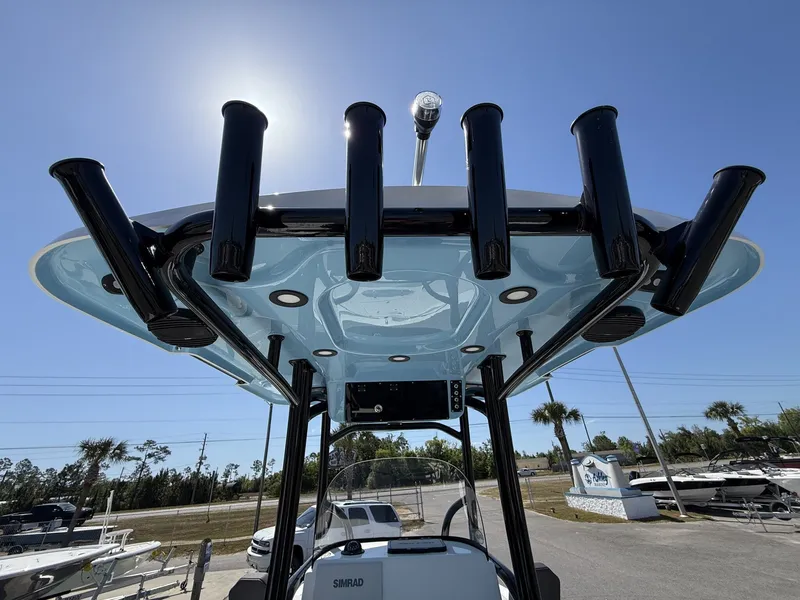 Slide: The Image of Sea Pro 250 Bay 2026 with fishing rod holders and T-top. - 11