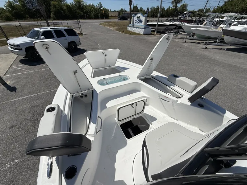 Slide: The Image of 2026 Sea Pro 250 Bay boat with open storage compartments. - 8
