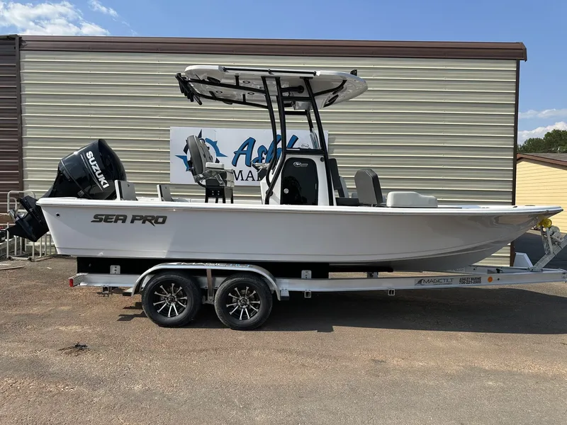 The Image of 2026 Sea Pro 230 Bay boat on trailer outside warehouse. - 1