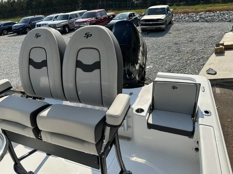 Slide: The Image of 2026 Sea Pro 230 Bay boat with gray seats outdoors. - 6