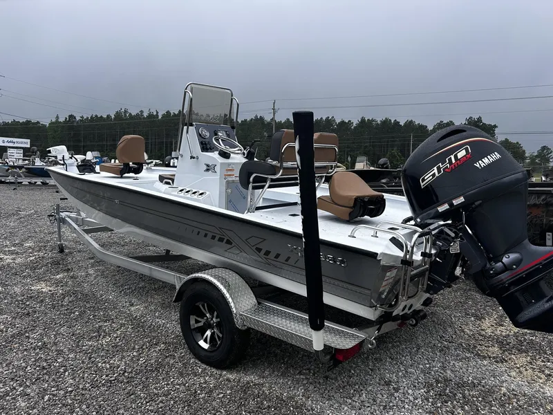 Slide: The Image of 2026 Xpress H20B Bay boat with Yamaha engine on trailer. - 3