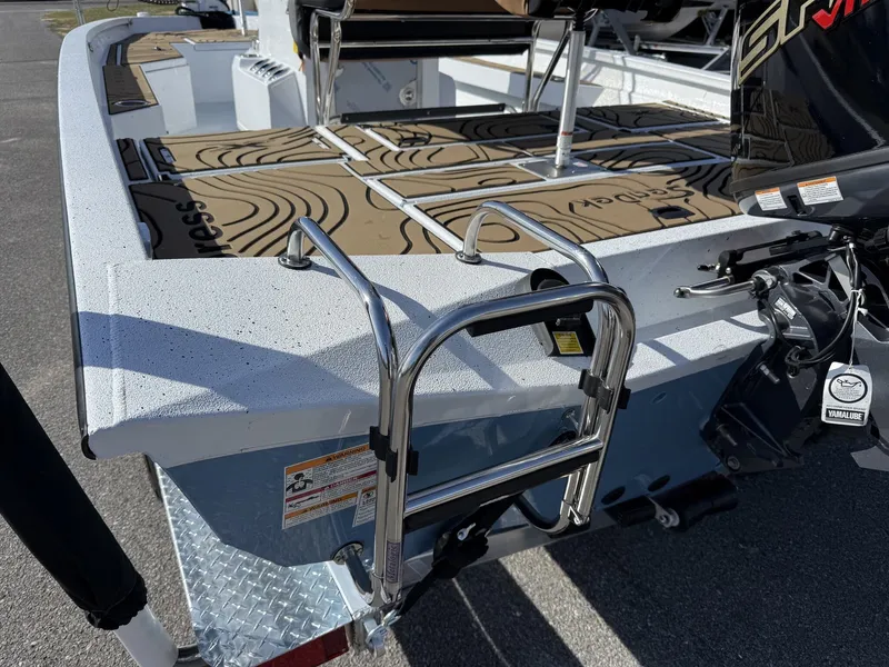 Slide: The Image of 2026 Xpress Hyper-Lift Bay Series H20B boat with ladder and motor. - 8