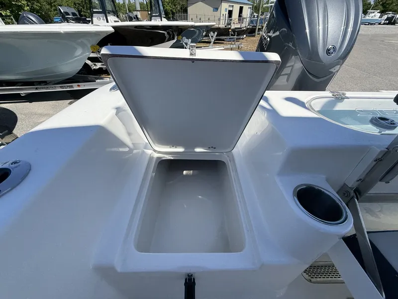 Slide: The Image of Open storage compartment on a 2026 Sea Pro 222 Center Console boat. - 10