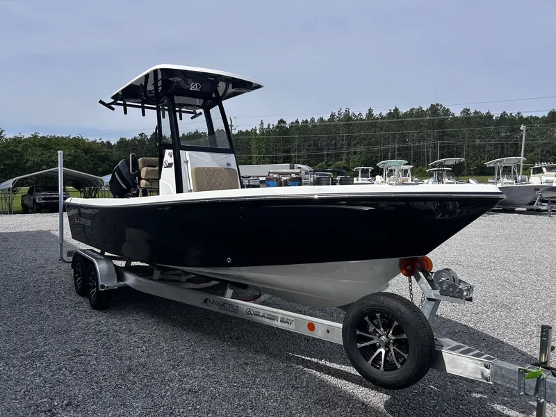 Slide: The Image of 2026 Blazer Bay 2440 boat on trailer outdoors. - 3