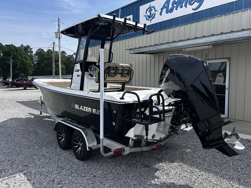 Slide: The Image of 2026 Blazer Bay 2440 boat with outboard motor on trailer. - 7