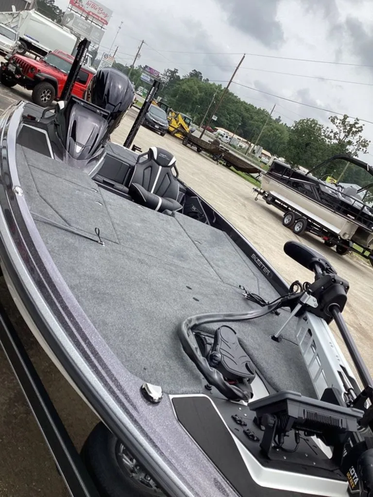 Slide: The Image of 2026 Skeeter ZXE21 boat on a lot, overcast sky. - 21