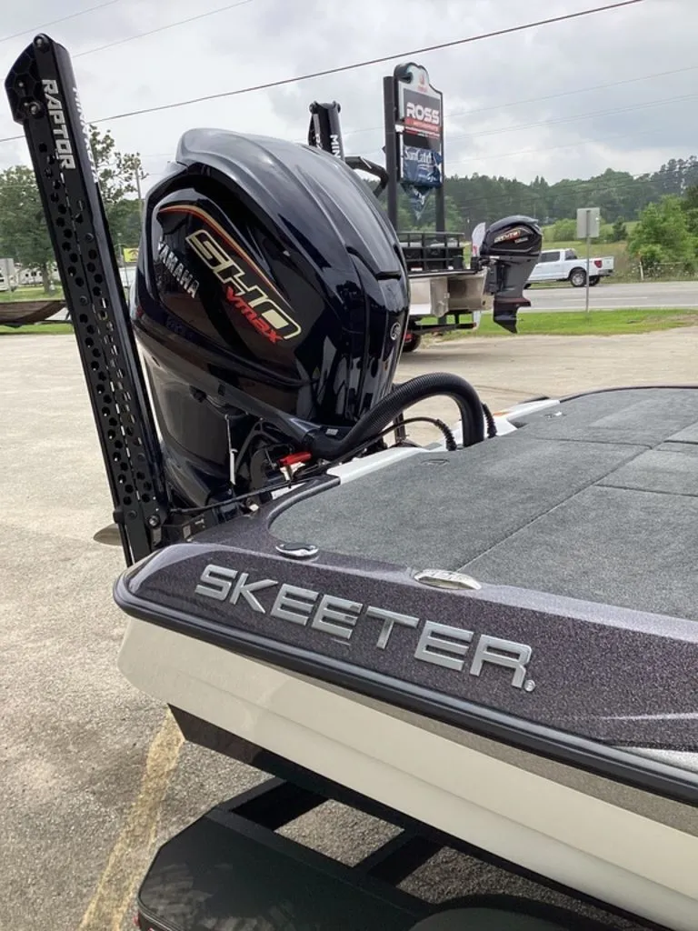 Slide: The Image of Skeeter ZXE21 boat with Yamaha engine, 2026 model, in parking lot. - 24
