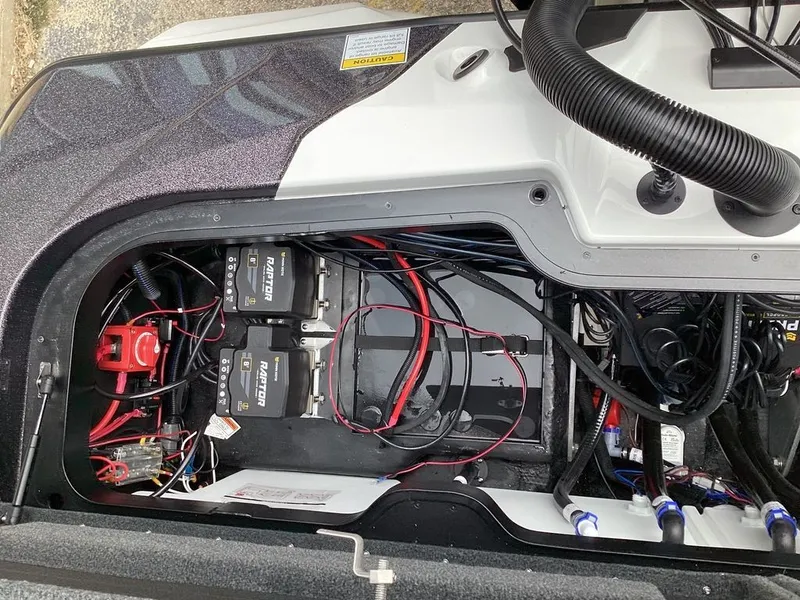 Slide: The Image of Interior view of Skeeter ZXE21 2026 with batteries and wiring. - 25