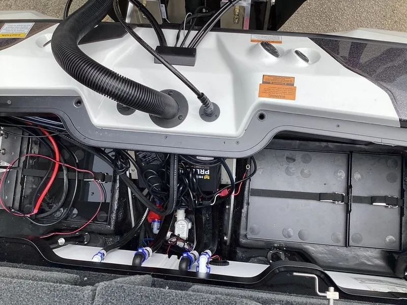 Slide: The Image of Interior view of 2026 Skeeter ZXE21 with cables and batteries. - 26