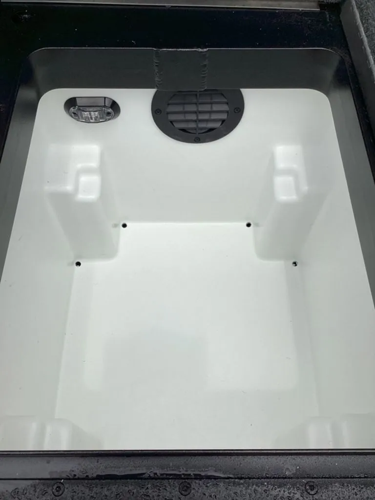 Slide: The Image of Interior of a 2026 Skeeter ZXE21 boat compartment. - 30