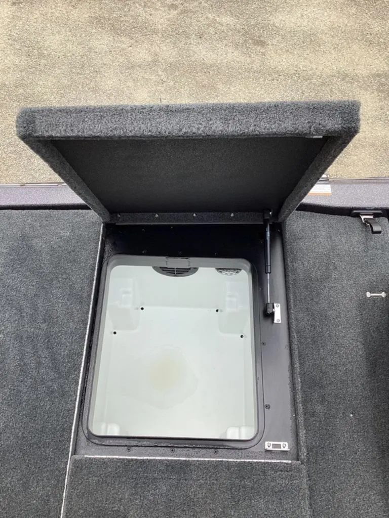 Slide: The Image of Open storage compartment of a 2026 Skeeter ZXE21 boat. - 32